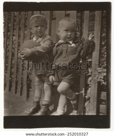 Old Black and white photographs of two young brothers.