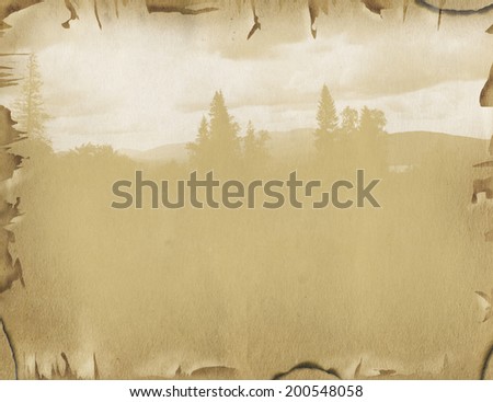 Old paper with landscape background. Page of the old book with woodland scenery and tattered edges yellowed sheet of paper, faded background.