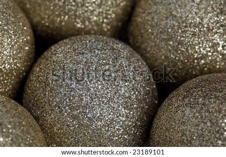 This is an image of gold glitter covered balls.