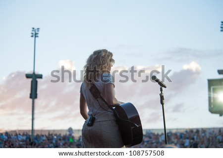 WHEATLAND, CA - JULY 26: Kimberly Perry of The Band Perry performs in part of Brad Paisley\'s Virtual Reality Tour 2012 at Sleep Train Amphitheatre on July 26, 2012 in Wheatland, California.