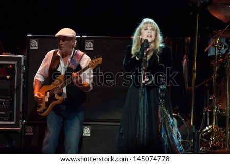 SACRAMENTO, CA - JULY 6: John McVie (L) and Stevie Nicks of Fleetwood Mac perform in support of the bands\' Extended Play release at Sleep Train Arena on July 6, 2013 in Sacramento, California.