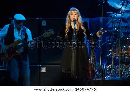 SACRAMENTO, CA - JULY 6: John McVie (L) and Stevie Nicks of Fleetwood Mac perform in support of the bands' Extended Play release at Sleep Train Arena on July 6, 2013 in Sacramento, California.