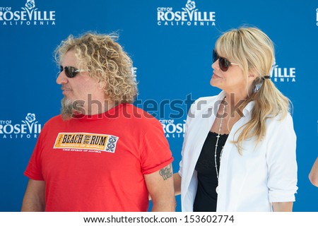 ROSEVILLE, CA - September 5: Sammy Hagar and wife Kari make a donation to the Placer Food Bank and Me One Foundation at Roseville's Town Sqaure in Roseville, California on September 5, 2013