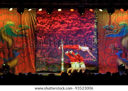 LINCOLN, CA - JAN 20: The Chinese Acrobats Of Hebei perform hoop diving at Thunder valley Casino in Lincoln, California on January 20, 2012