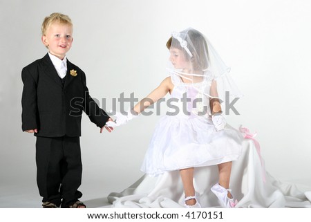 boy and girl holding hands coloring. stock photo : toddler oy and