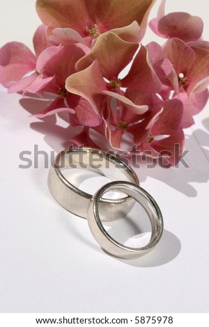 stock photo wedding rings with floral decoration