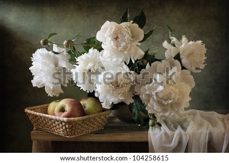Still life with beautiful peonies and apples