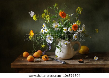 Still life with a beautiful bouquet of flowers and butterflies