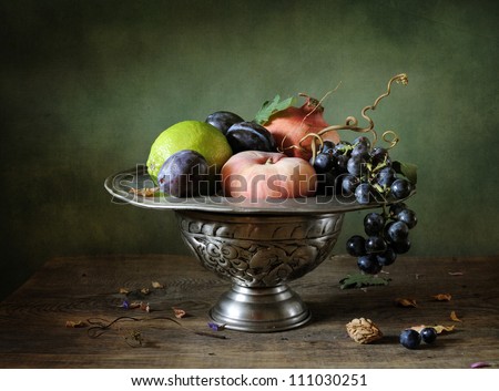 Still life with grapes and pomegranate