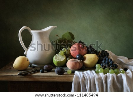 Still life with a plate full of fruit