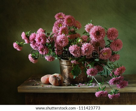 Still life with a bunch of asters and peaches