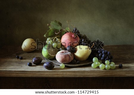 Still life with fruit in a silver plate