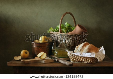 Still life with apples and fresh bread