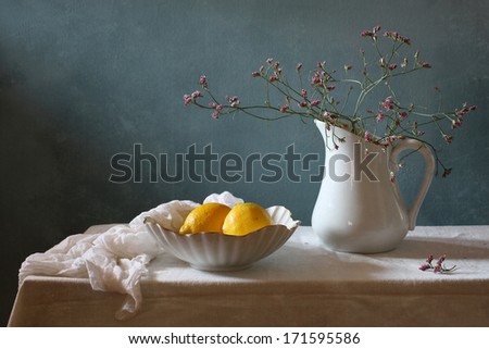 Still life with lemons and spring flowers