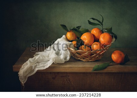 Still life with mandarins and drapery