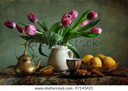Still life with pink tulips and apples