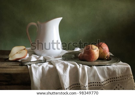 Still life with drapery and red pears