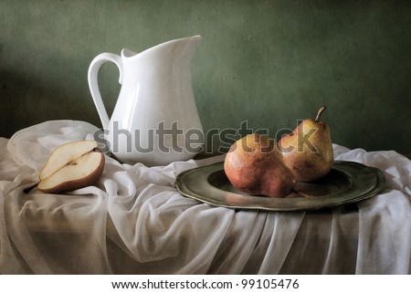 Still life with red pears and a jar