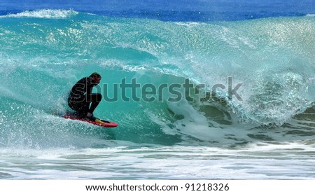 Surfer surfing wave off the coast of Western Australia