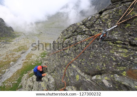 Climber on climbing route in Fagaras mountains, Romania