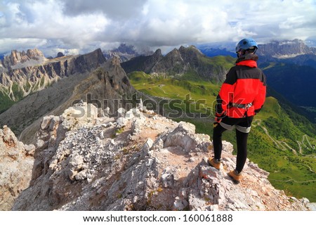 Mountaineer at high altitude on the alpine trail, Dolomite Alps, Italy