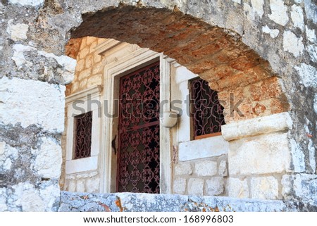 Stone arch of medieval fortress of Kotor in Mediterranean sea area