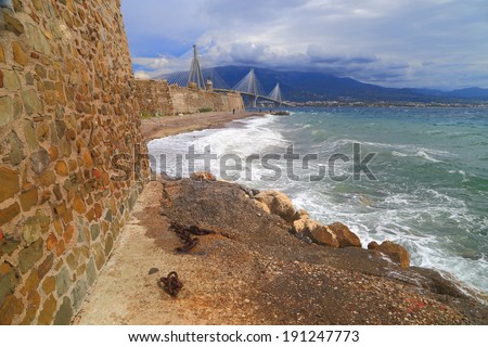 Stormy waves hit the walls of the medieval fortress in Antirrio, Greece