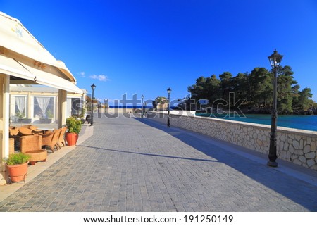 Sunny walkway and tavern near the Ionian sea, Greece