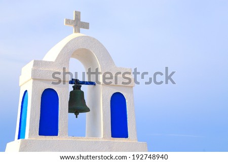 White church tower and bell on the island of Santorini, Greece