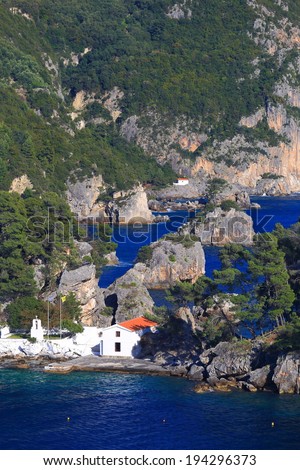 White church isolated on a small island, Greece