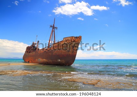 Rusty ship wreck on sunny Selinitsa beach near Gytheio, Greece