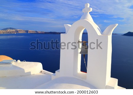 Church roof and white bell tower on the Santorini island, Greece
