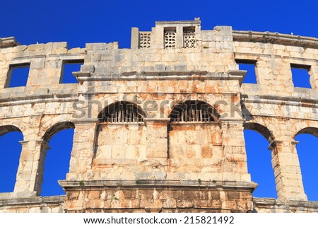 Stone arches of an ancient Roman amphitheater, Pula, Croatia