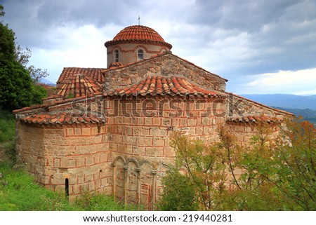 Dark clouds above old Byzantine church inside the fortress of Mystras, Greece