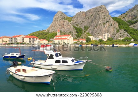 White boats anchored in small harbor on the Dalmatian coast, Omis,Croatia