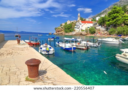 Fishing and leisure boats inside small harbor on the Dalmatian coast, Croatia