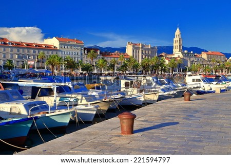 Old buildings and Venetian church tower behind sunny harbor on the Adriatic sea cost, Split, Croatia