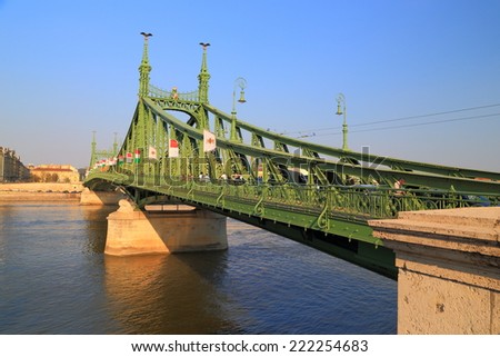 Traditional steel bridge painted green across Danube river, Budapest, Hungary