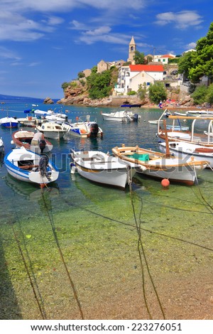 Boats anchored in small harbor on the Dalmatian coast, Croatia