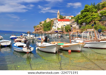 Crowded harbor with small fishing and recreational boats on the Dalmatian coast, Croatia