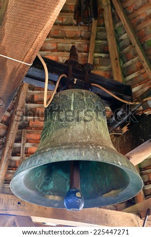 Bronze bell hanging on a tall tower of the Fortified Church of Carta (listed on UNESCO World Heritage), Transylvania, Romania
