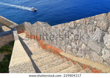 Ramp of stairs ascending to the walls defending old town above Adriatic sea, Dubrovnik, Croatia