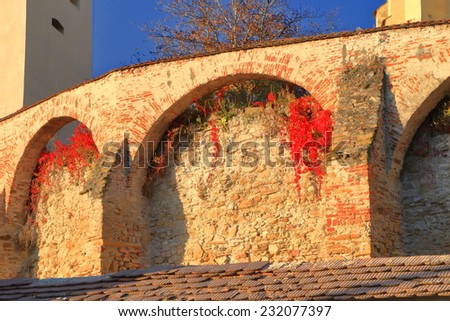Autumn colors decorate the walls of ortified church from UNESCO world heritage list in Biertan village, Transylvania, Romania