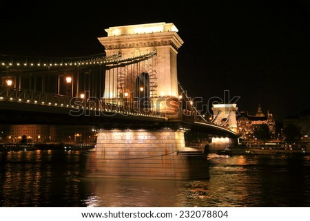 Lights illuminate the large pillars of the Chain bridge at night, Budapest, Hungary