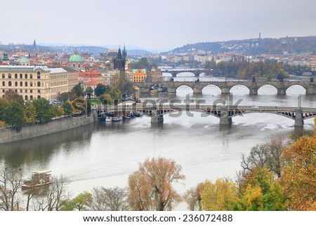 Bridges across Vltava river in cloudy autumn day, Prague, Czech Republic