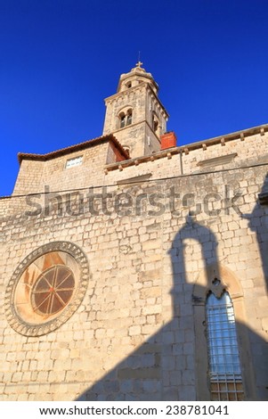Stone wall of a church with Venetian architecture inside the old town of Dubrovnik, Croatia