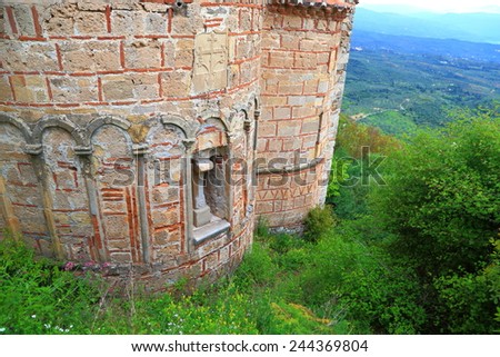 Detail of Byzantine architecture of a church with brick walls inside Mystras fortress, Greece