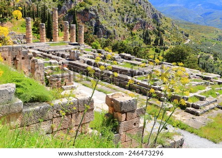 Sunny valley on Parnassus Mountains and Greek temple of the sun god Apollo, Delphi, Greece