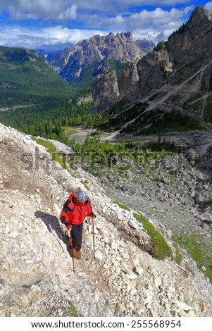 Hiker woman on Durissini trail, Dolomite Alps, Italy