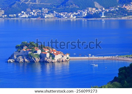 Thin stretch of land connects old Venetian town on an island to the Adriatic sea shore, Montenegro